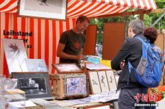 德国“解封”进行时：柏林墙下市集重开 院线再